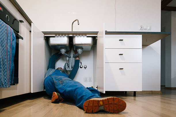 Professional Emergency Plumber technician working in Potomac, MD